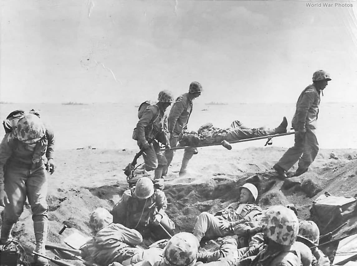 Medics carry wounded Marine on Iwo Jima