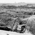 23rd Marines clear pillbox by wrecked A6M5