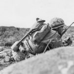 3/21 Marines crawling forward under fire at Airfield 2 Iwo Jima 24 February 1945
