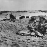Dead Japanese lie in a shell hole on the ashy slopes below Mt Suribachi