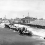 Equipment and ships on Red Beach 1 Iwo Jima