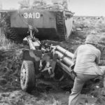 Marine 105mm Howitzer towed by LVT Iwo Jima 23 February 1945