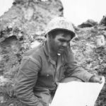 Marine studies map during fighting on Iwo Jima