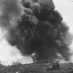 Marine demolition man blasts Japanese Pillbox on Iwo Jima