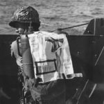Marine enroute to Iwo Jima with flamethrower named „Miss Spitfire”