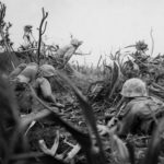 Marine flame thrower team in action on Iwo Jima 21 February 1945