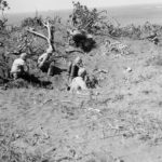 Marine flame thrower team maneuvers on Japanese bunker