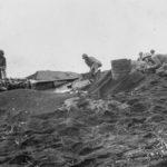 Marines clear sniper from aircraft wreck on Iwo Jima 22 February 1945