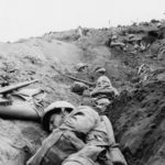 Marines dug In on Iwo Jima under mortar fire 22 February 1945