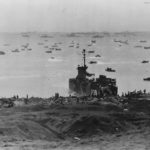 Marines unloading supplies from LSM-238 on Iwo Jima Beach