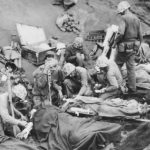 Wounded Marines being treated at Aid Station on Iwo Jima