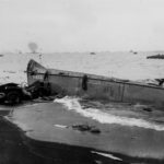 Wrecked Jeep and LCVP on Iwo Jima Beach 19 February 1945