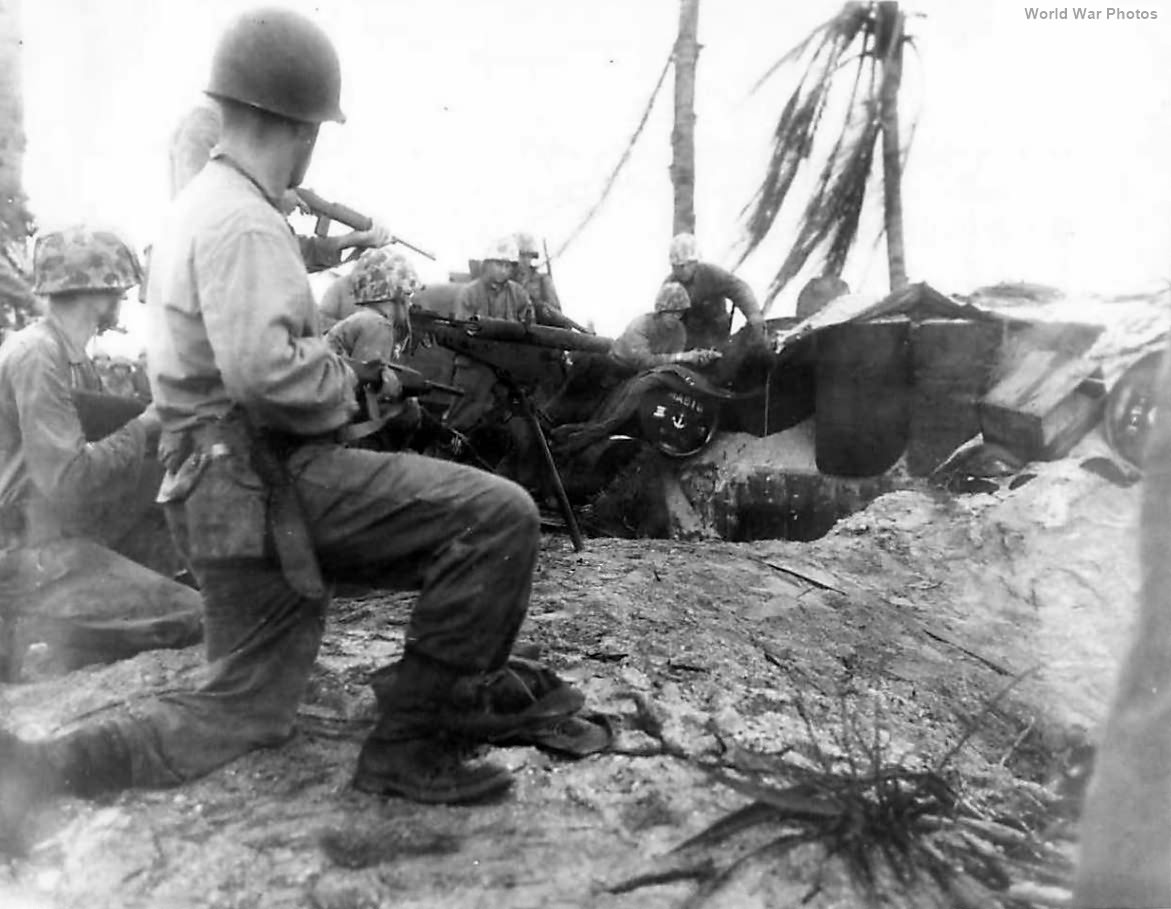 4th Div Marines work to coax Japanese from pillbox on Namur
