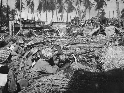 7th Division M10 and machine gunners advance on Kwajalein