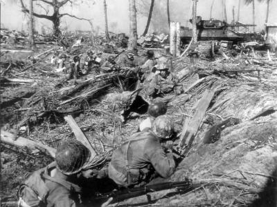 7th Infantry Division soldiers and 767th Tank Battalion M10 advance on Kwajalein