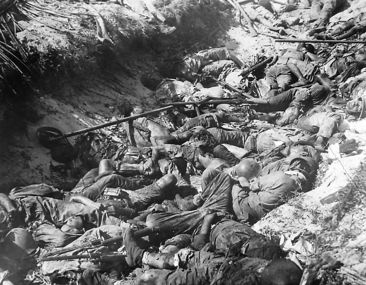 Bodies of fallen Japanese soldiers in trench on Namur Island