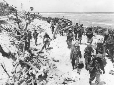Marines move inland after landing on Roi Island