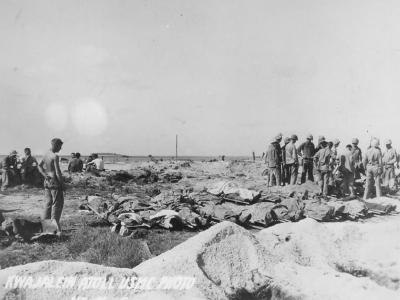 Troops check IDs on fallen soldiers on Kwajalein