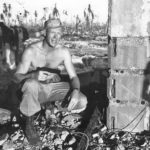 4th Division Marine Lt Willis amid ruins on Namur Island