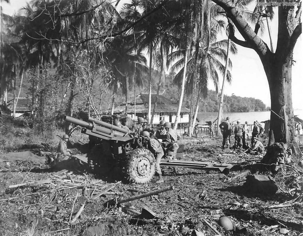 Allied troops set up M2A1 105mm howitzer in Depapre New Guinea 1944