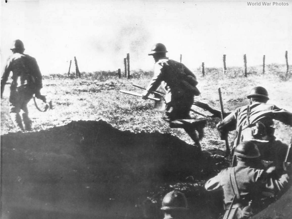 Japanese infantrymen leaving a trench near Buna during fighting in New Guinea 43
