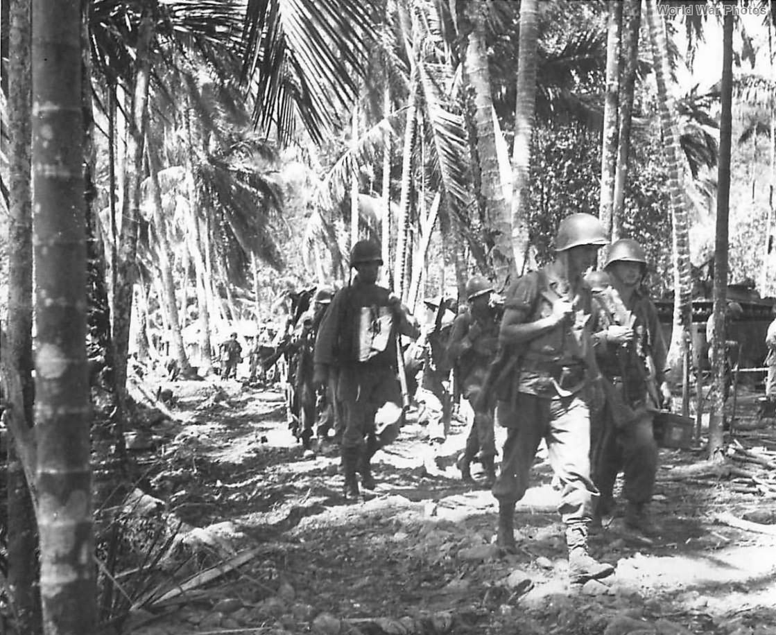 US troops march thru village of Depapre 1944