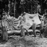 41st Division soldiers with Captured Japanese Flags in New Guinea