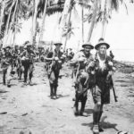 Australian troops advance from Gona toward Buna New Guinea 1943