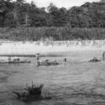 Australian wounded transported by log rafts in New Guinea