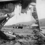 LVTs pass wreck of Japanese plane at Sentani Hollandia