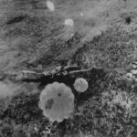 Parachute bombs fall on Japanes plane on airfield at Hollandia