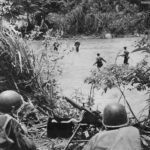 US troops advance under cover of Machine Gun in New Guinea 1944