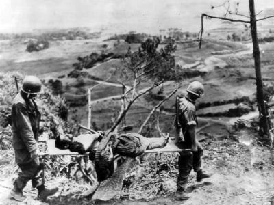 10th Army Soldiers Carry Wounded Native on Okinawa