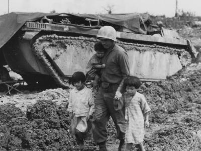 77th Infantry Division Soldier Saving Okinawan Children Next to LVT Buffalo 1945
