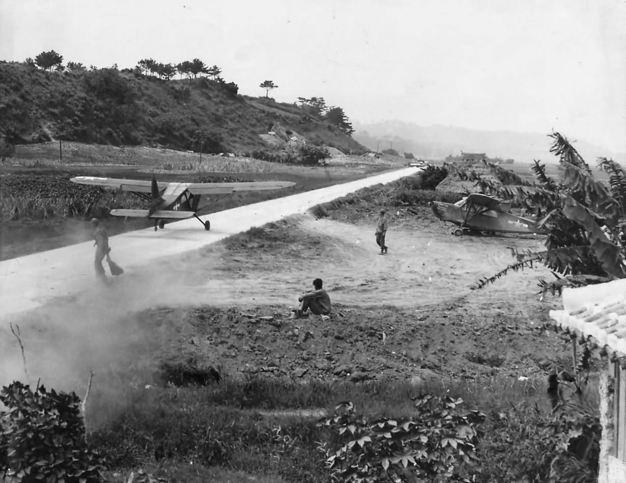 Stinson L-5 Sentinel Carries Wounded Marine from Itoman near Okinawa Front