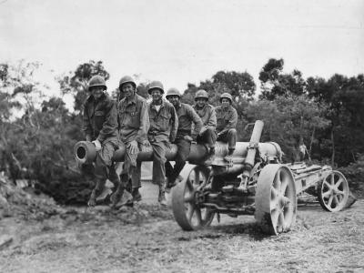 Troops on Captured Japanese 150 mm gun Type 89 Cannon on Okinawa