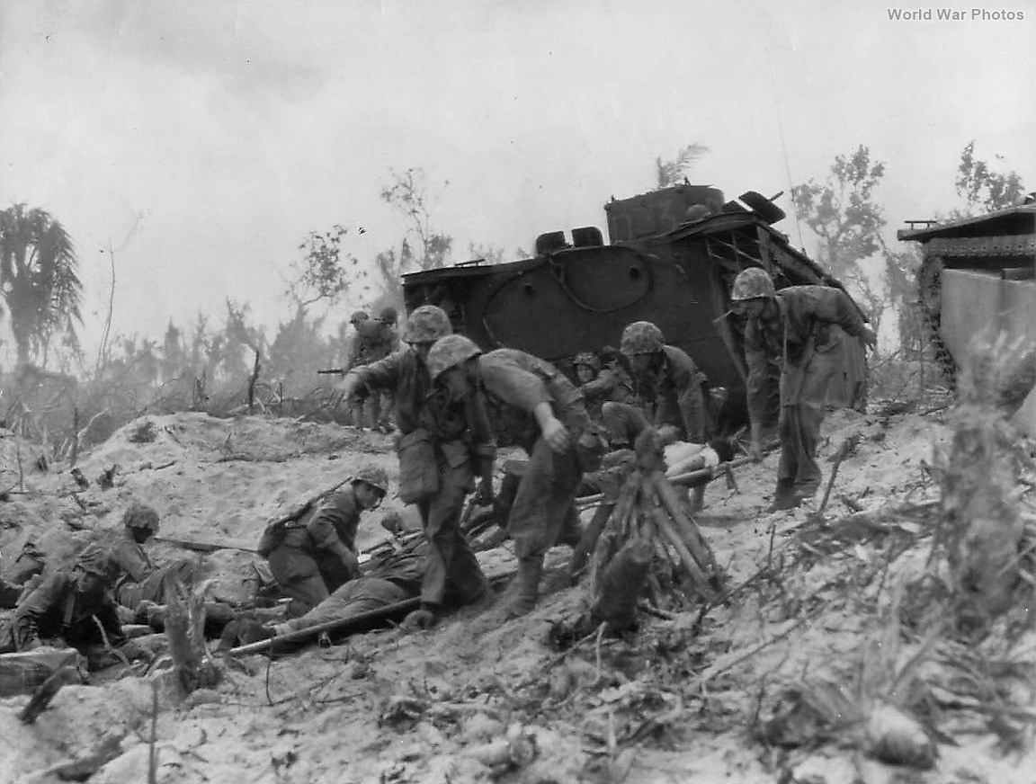 1st Division Marines Carry Wounded Comrades to Peleliu Beach