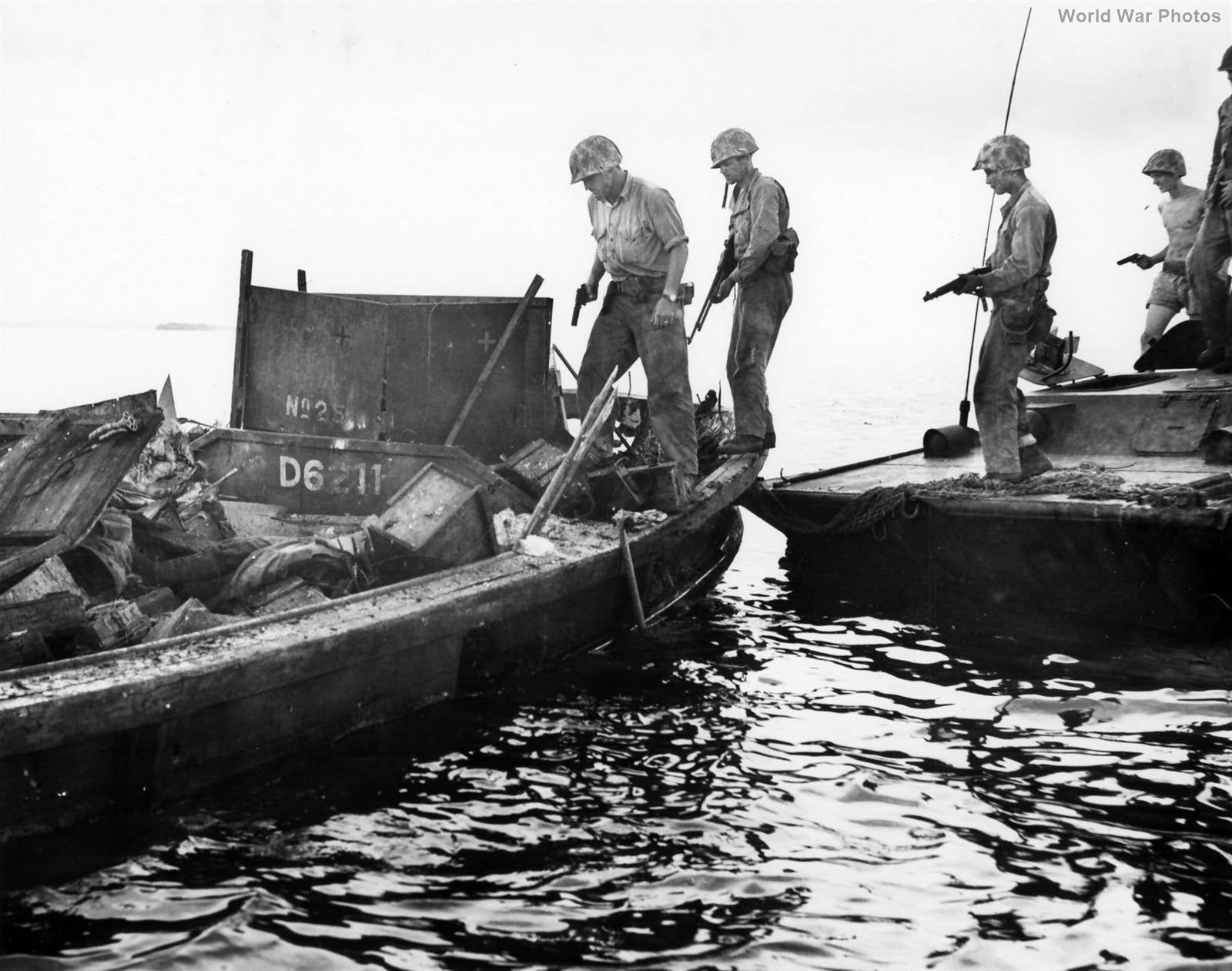 M1911 Armed Marines Board Japanese Landing Craft from LVT Peleliu