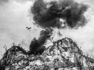 Marine F4U making a napalm run against Japanese defenses 2