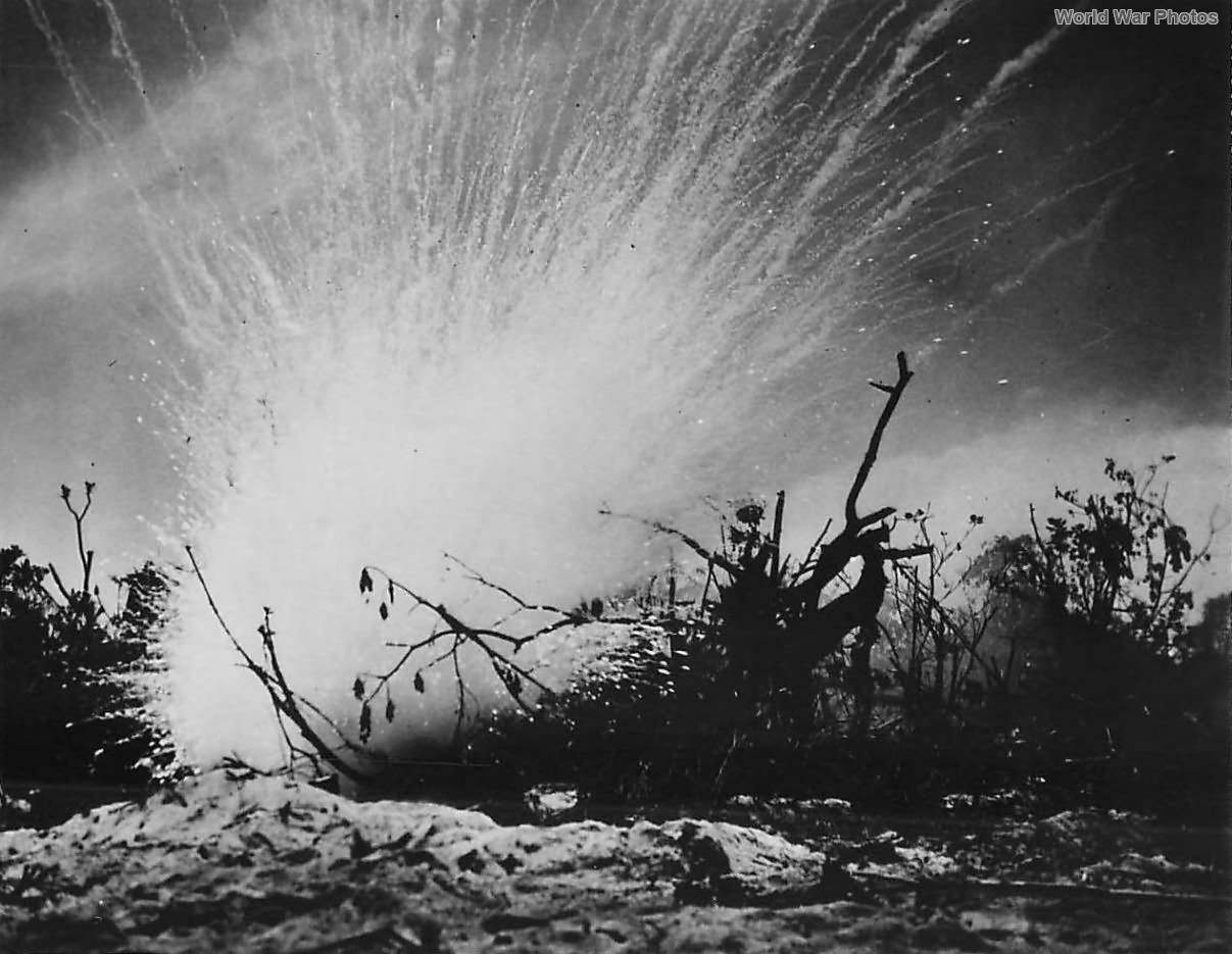 Phosphorous grenade explodes over Japanese pillbox