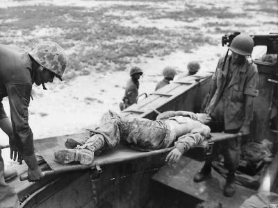 Wounded 1st Division Marine Being Evacuated from Peleliu Beach