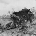 1st Division Marines Carry Wounded Comrades to Peleliu Beach