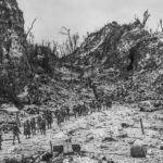 1st Marine advancing into the hills beyond the airfield at Peleliu