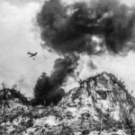 Marine F4U making a napalm run against Japanese defenses 2