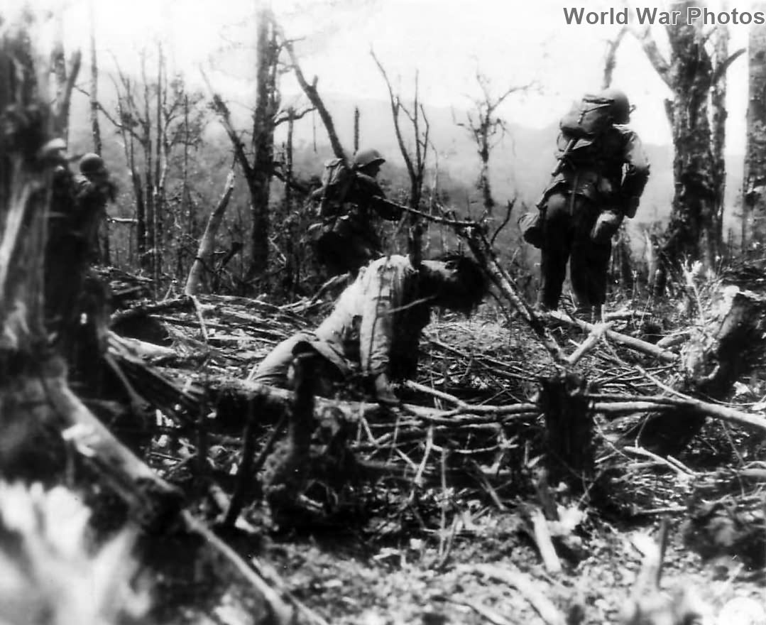25th Division troops pass Japanese soldier impaled on tree Luzon 1945