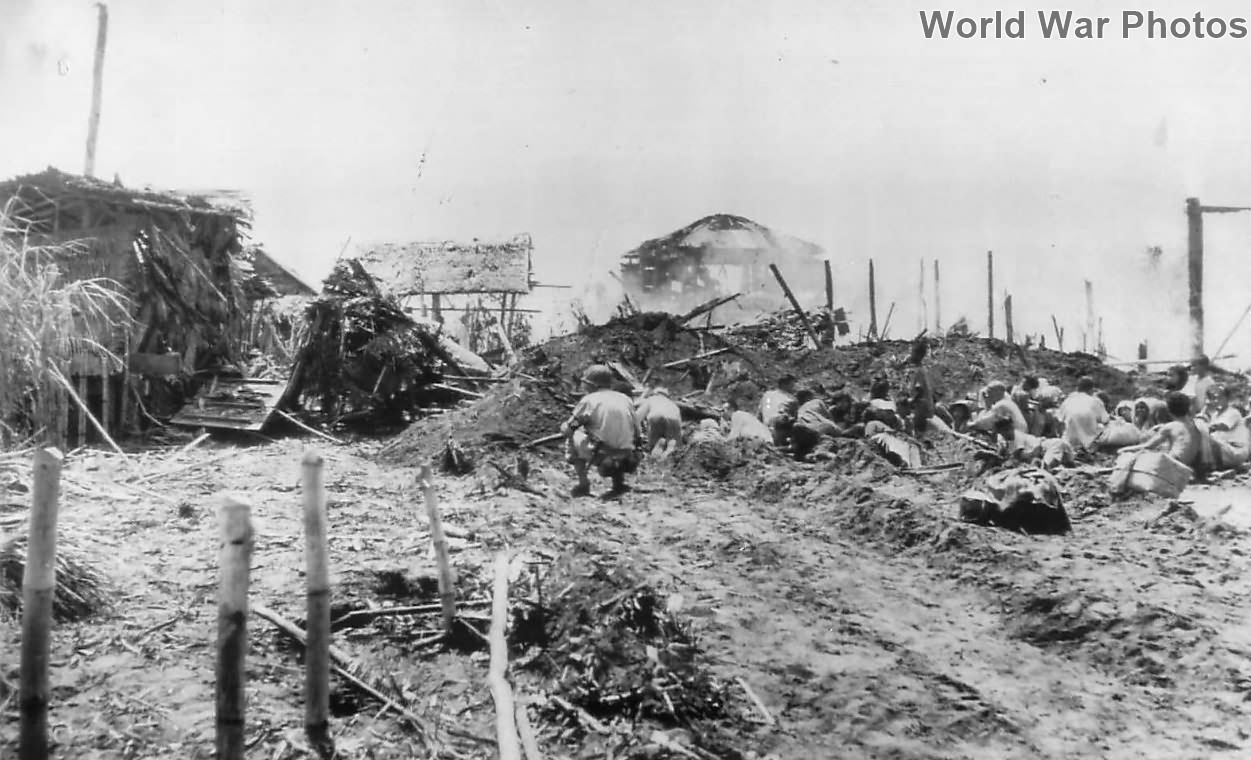 7th Division hunt Japanese snipers in the village of Dulag on Leyte