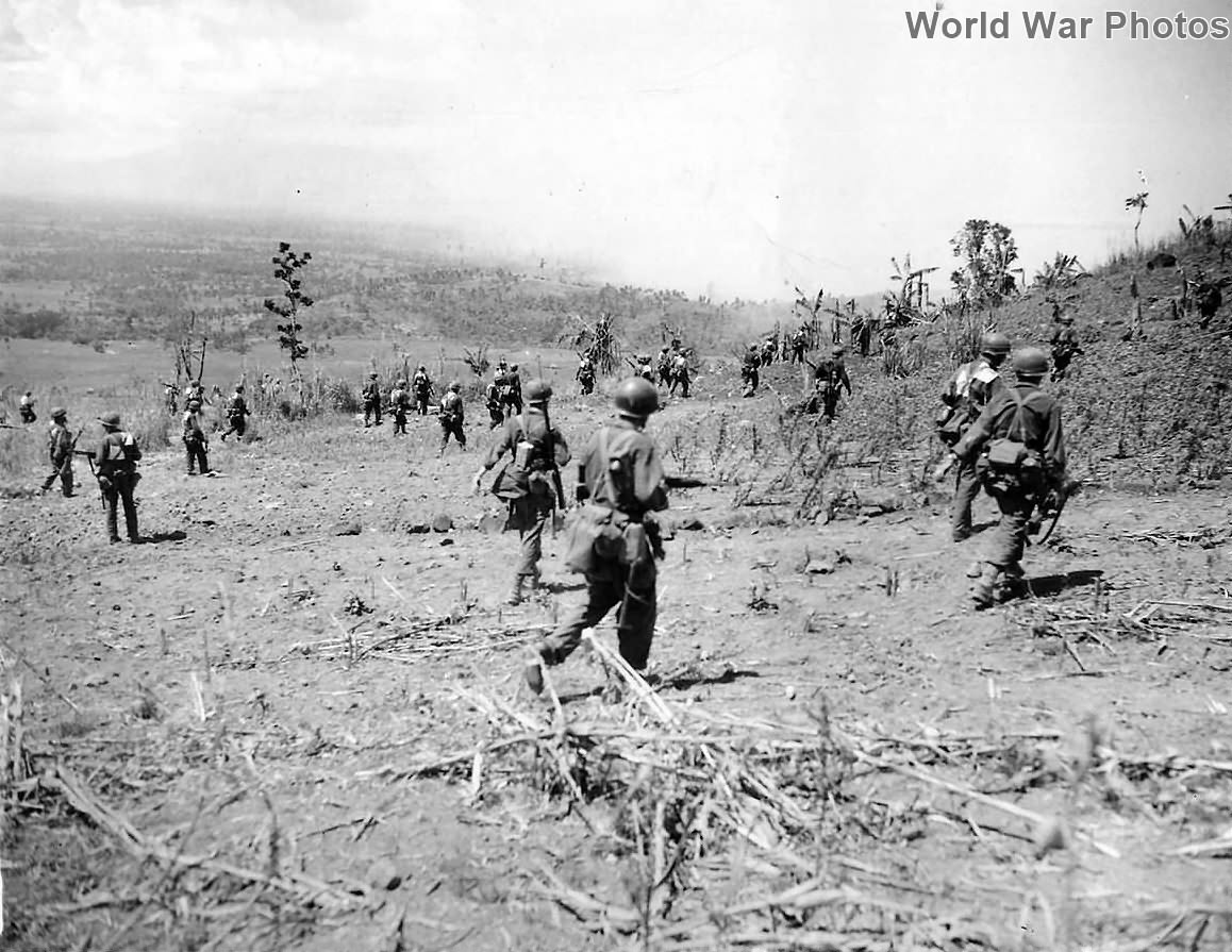 96th Division soldiers advance over Catamon Hill on Leyte