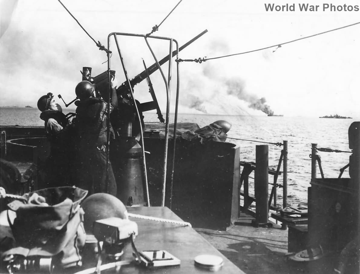 Gun crew in action on LCI during Invasion of Mindoro