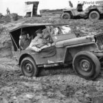 Gen MacArthur riding in Jeep at Jeep Landing on Leyte 1944