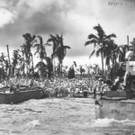 Landing Craft from USS Callaway unload troops supplies on Leyte